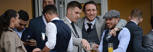 English footballers Samir Carruthers, Luke Ayling and Jameds Collins behaving badly at Cheltenham